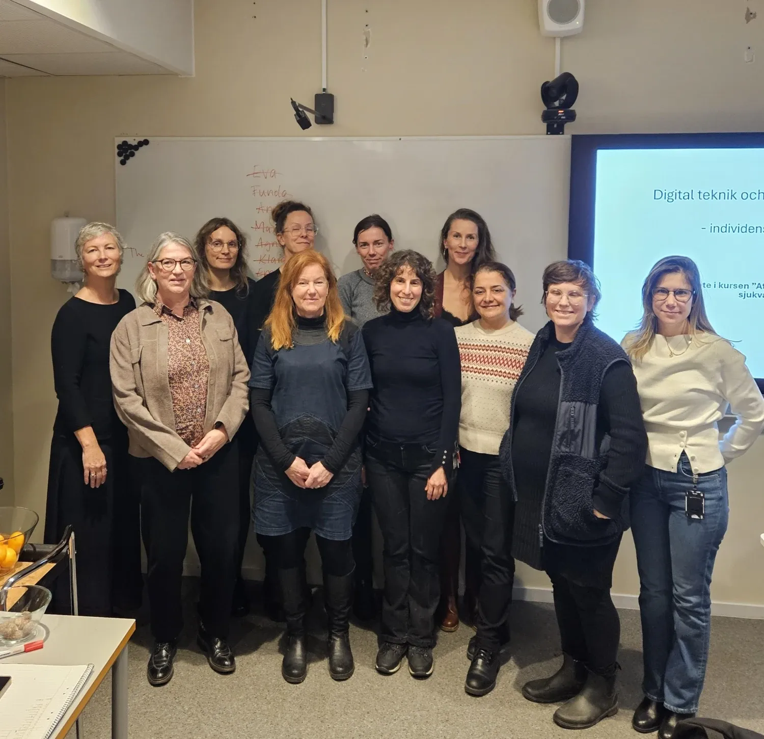 A group of teachers in a classroom.