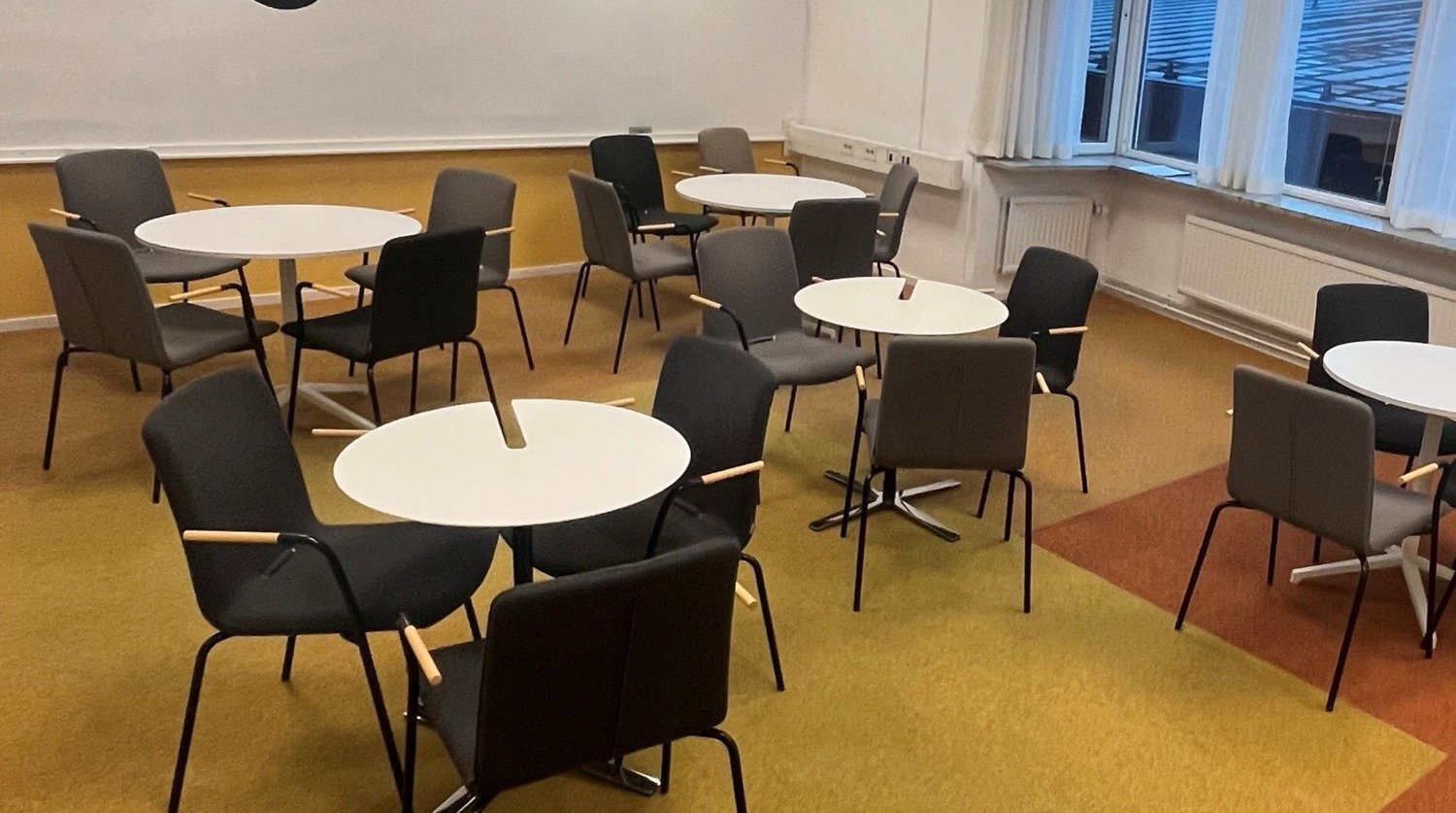 Shows study room 353 with round tables