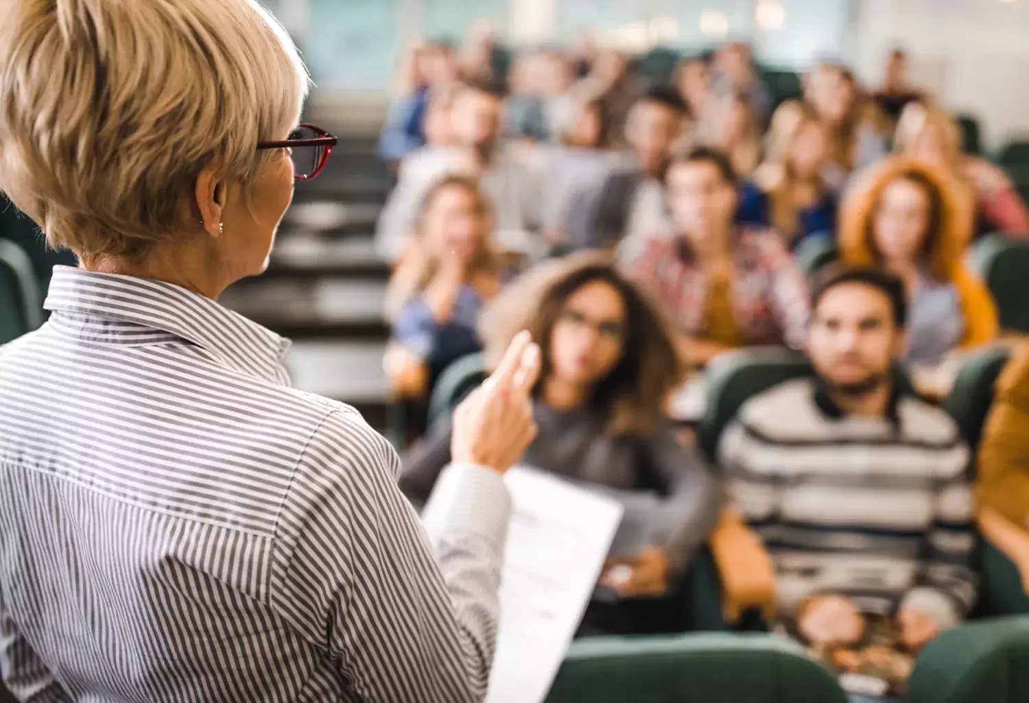 A woman presenting for a class