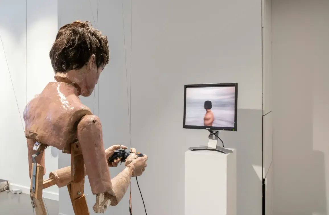 Picture of a man playing video games.