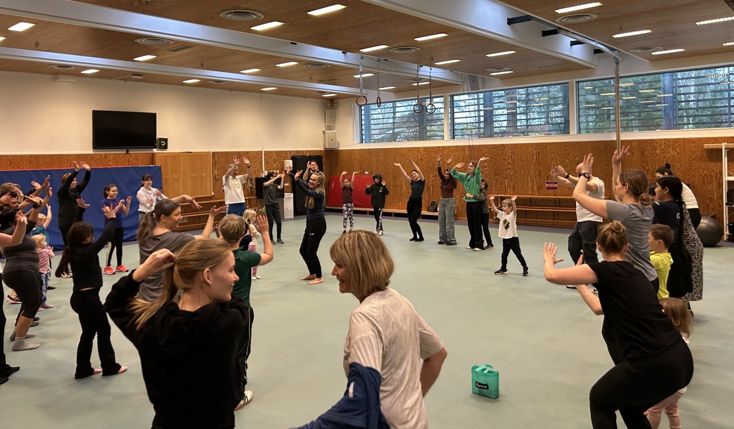 Families moving together in KI's wellness spaces.