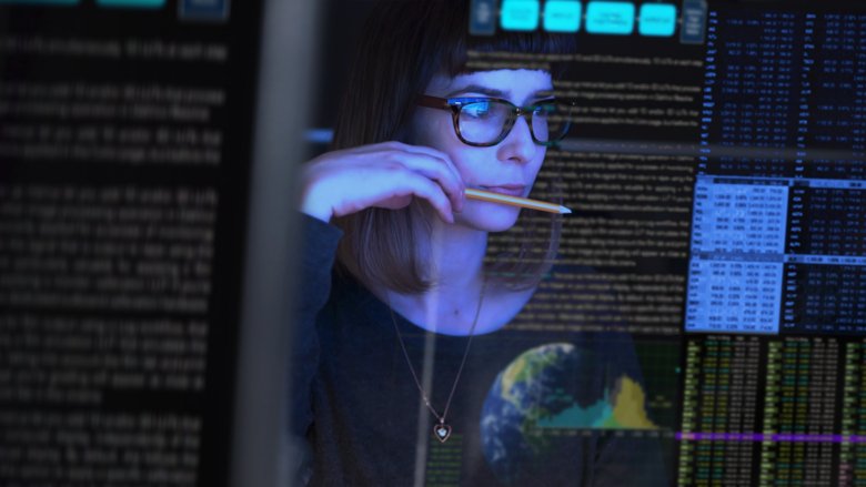 Woman looking at computer screens