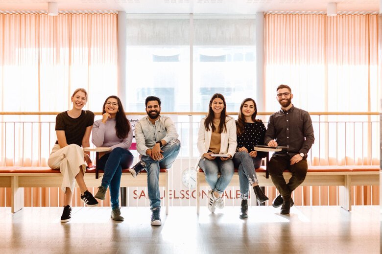 Students on a bench in Sheele building.