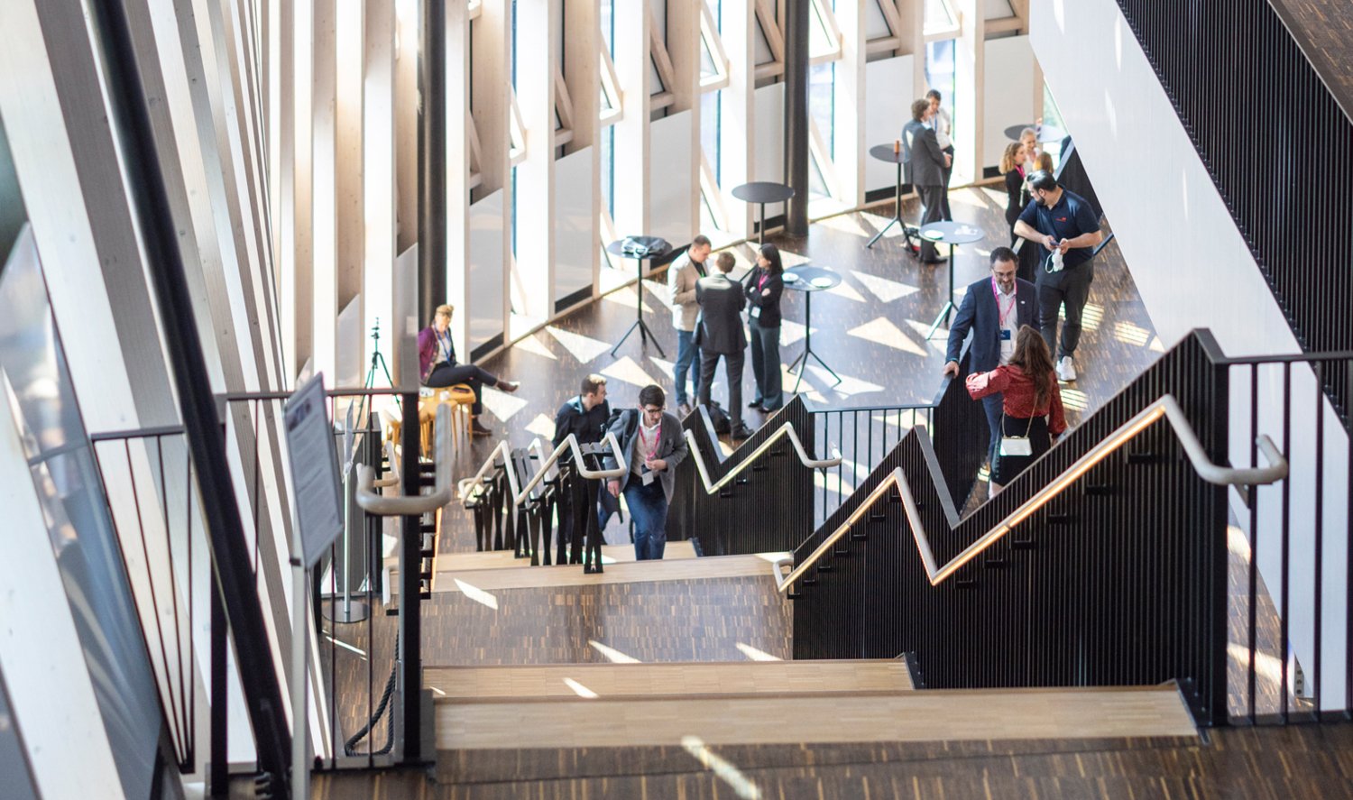 People walking in the stairs inside the aula medica.