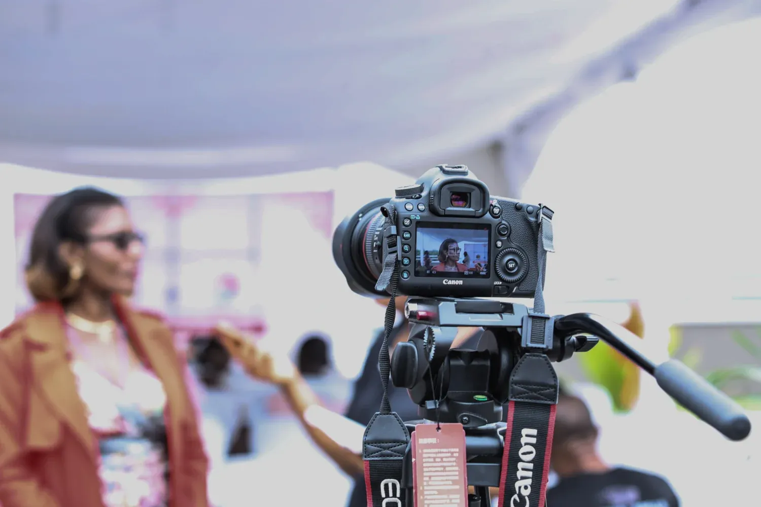 A woman being interviewed in front of a camera.