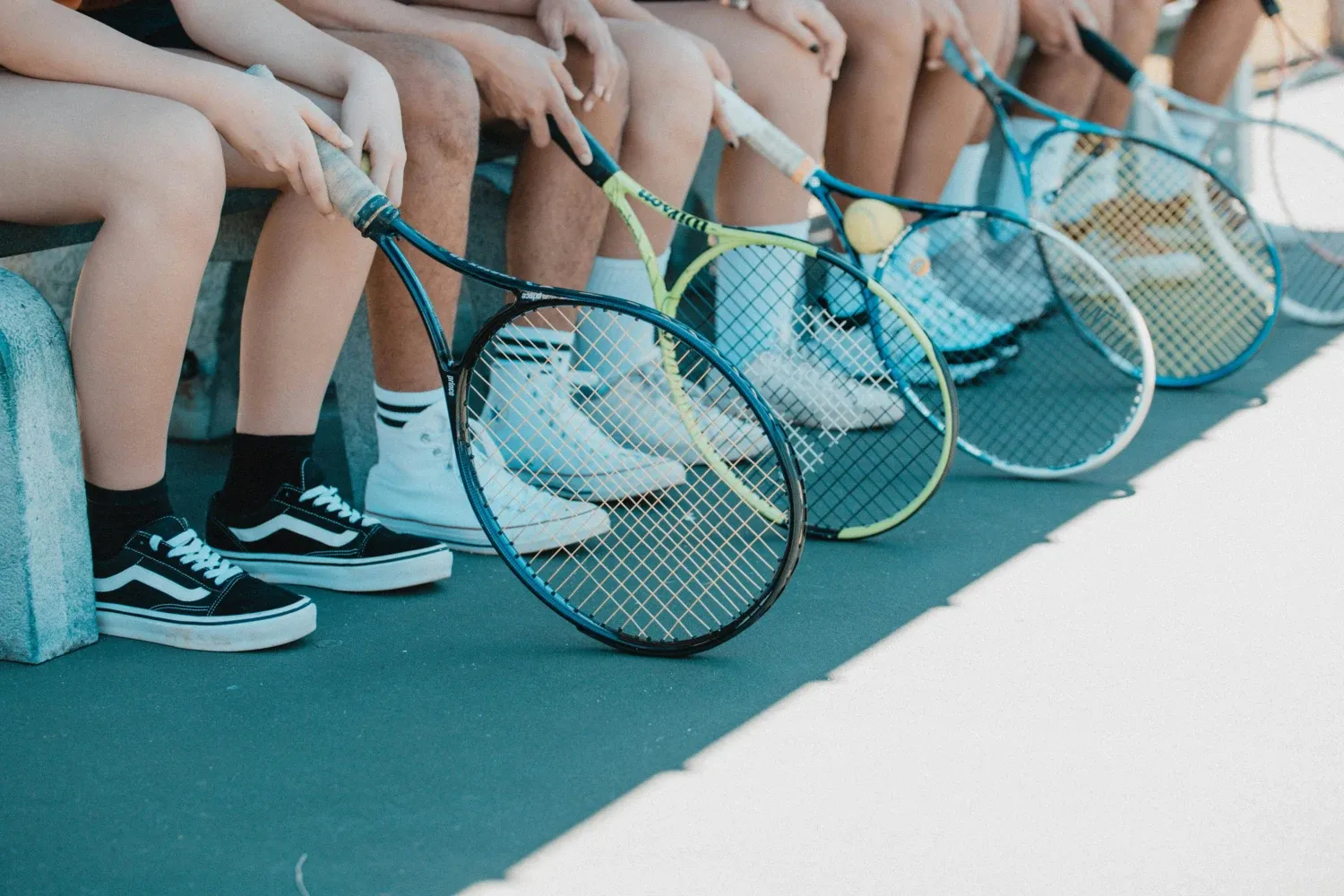 People with tennis rackets.