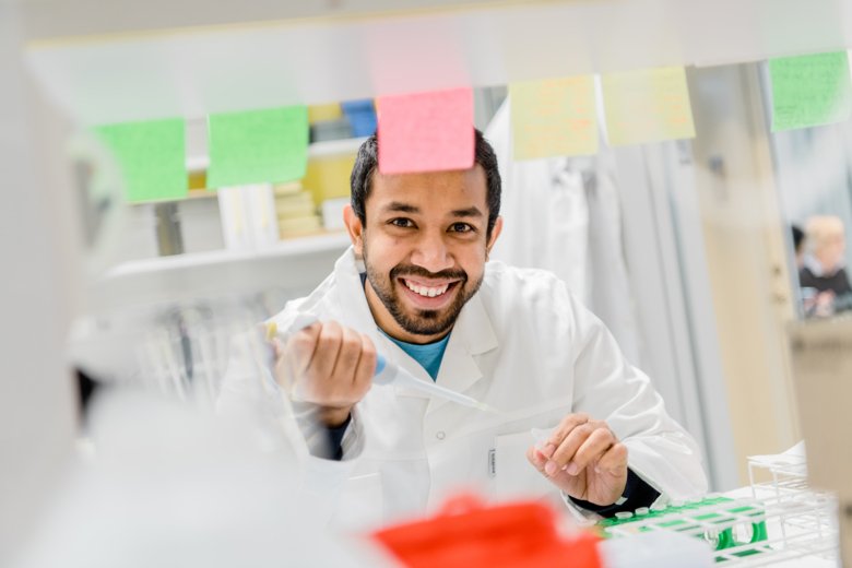 Researcher smiling into camera