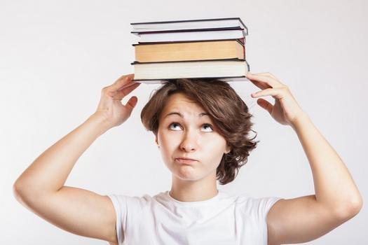 Girl with books on her head