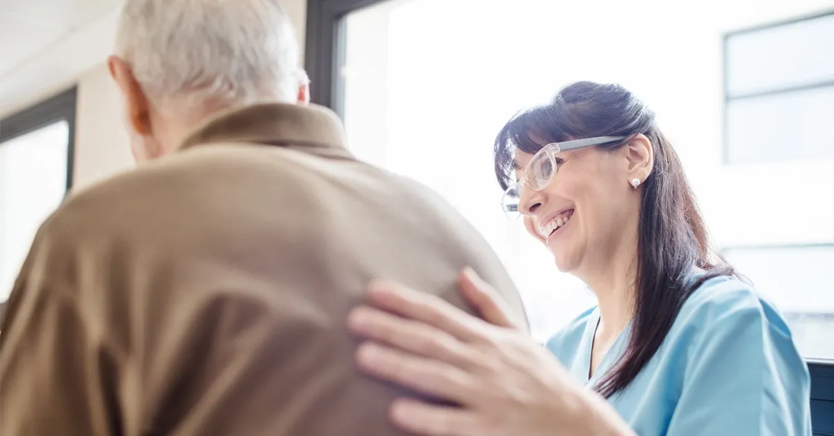 Health care professional with elderly patient