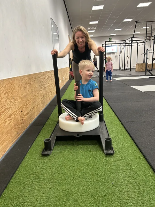 Families moving together in KI's wellness spaces.