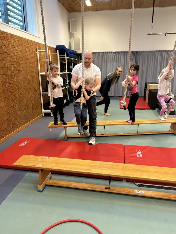 Families moving together in KI's wellness spaces.