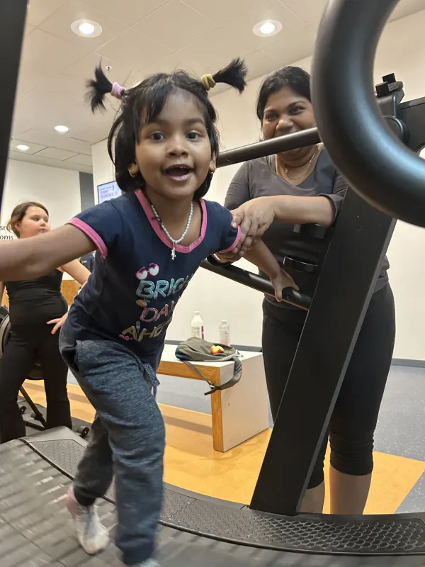 Families moving together in KI's wellness spaces.