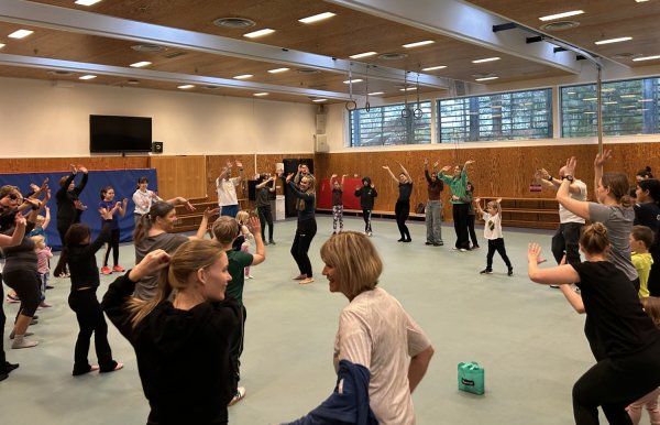 Families moving together in KI's wellness spaces.