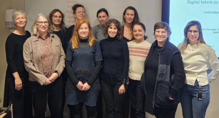 A group of teachers in a classroom.