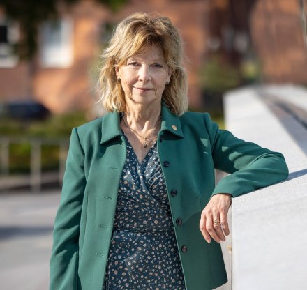 Business dressed woman outside