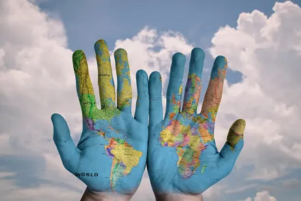 hands with map of the world